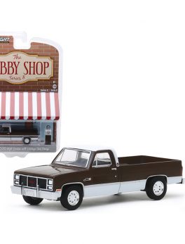 1984 GMC 2500 High Sierra Pickup Truck Brown Metallic and White and Vintage Gas Pump The Hobby Shop Series 8 1/64 Diecast Model Car by Greenlight 97080D