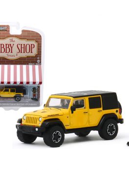 2015 Jeep Wrangler Unlimited Rubicon Hard Rock Yellow with Black Top and Backpacker Figurine The Hobby Shop Series 8 1/64 Diecast Model Car by Greenlight 97080F