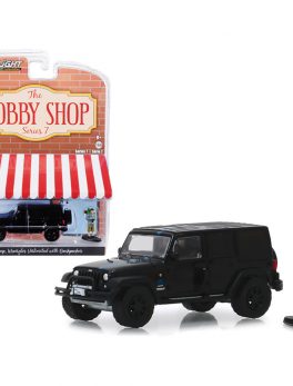 2012 Jeep Wrangler Unlimited MOPAR Off-Road Black with Backpacker Figurine The Hobby Shop Series 7 1/64 Diecast Model Car by Greenlight 97070F